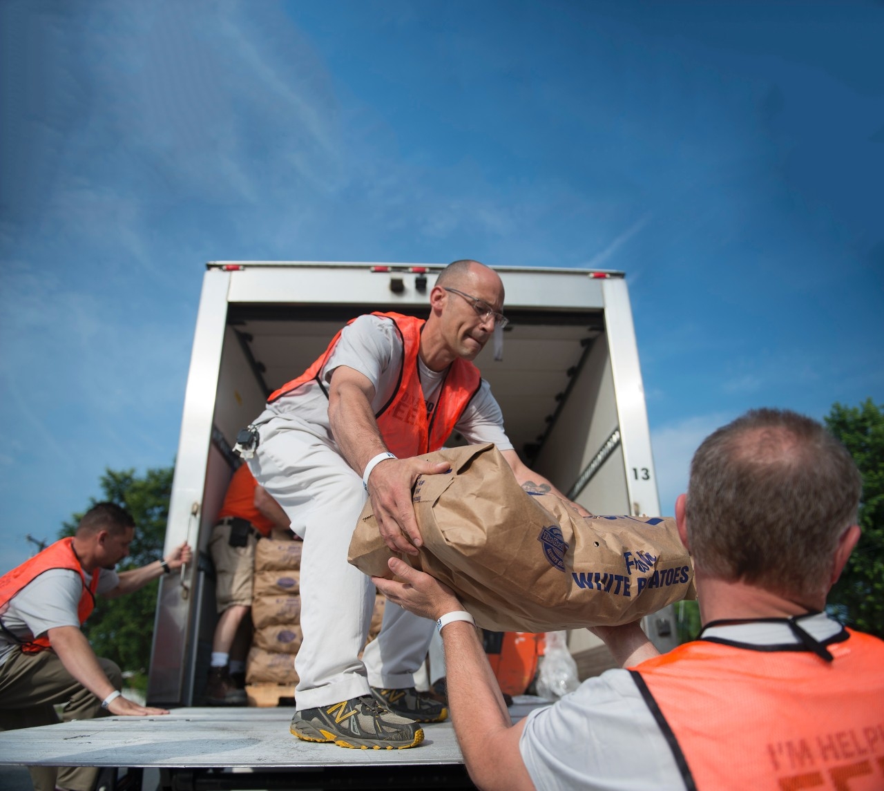 Food Lion Feeds volunteer unloading food from truck
