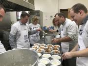 Local Food Lion associates in Hampton, Va., prepare meals to feed their neighbors in need at a local soup kitchen. (Photo: Business Wire)