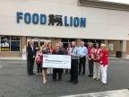 Food Lion associates Patty Holt and Mitch Hendrix present check to American Red Cross staff on behalf of Food Lion customers. (Photo: Business Wire)